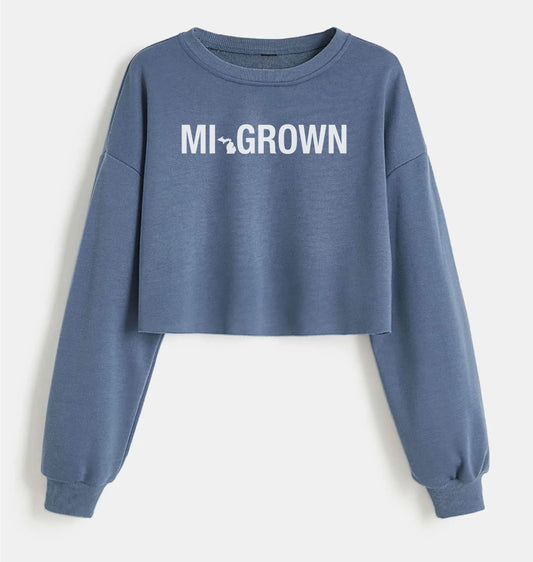 Blue crop top light weight sweatshirt. Michigan Grown. State of Michigan outline and state abbreviation. 